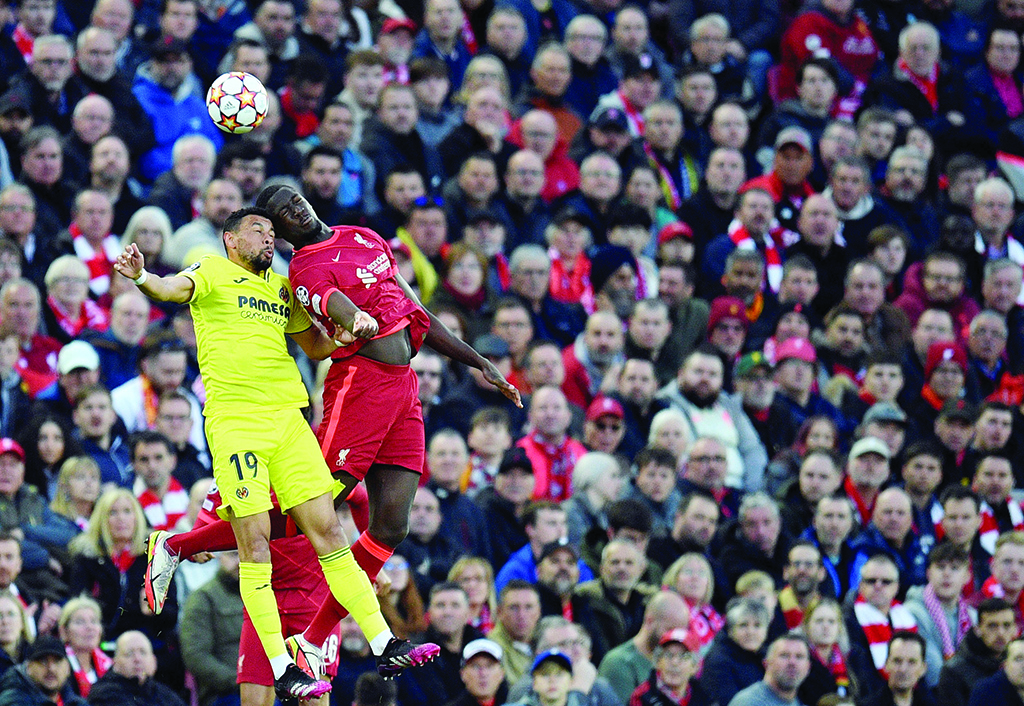 LIVERPOOL: Villarreal's French midfielder Francis Coquelin fights for the ball with Liverpool's French defender Ibrahima Konate during their UEFA Champions League semifinal first leg match at Anfield Stadium on April 27, 2022. - AFP