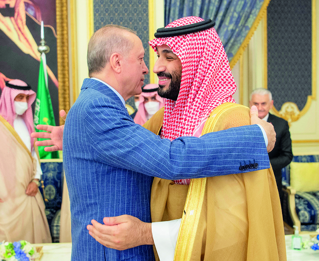 JEDDAH: Turkish President Tayyip Erdogan (left) hugs Saudi Crown Prince Mohammed bin Salman during a meeting in Saudi Arabia's Red Sea coastal city of Jeddah. - AFP