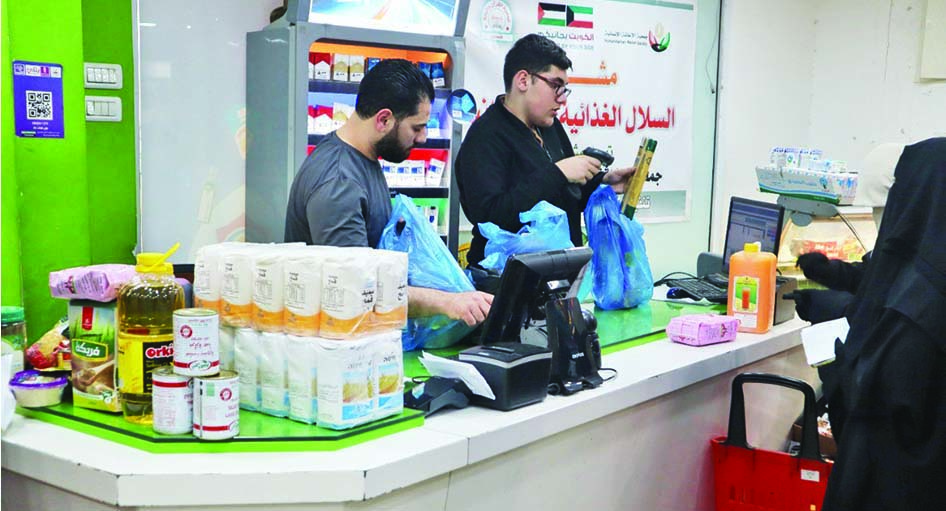 Kuwait Red Crescent Society distributes food baskets through a Palestinian charity.