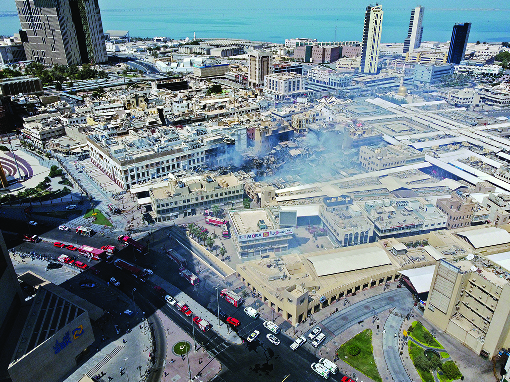 KUWAIT: An aerial view shows fire trucks deployed around Souq Mubarakiya in Kuwait City on April 1, 2022, a day after a massive fire gutted the heritage market. - Photos by Yasser Al-Zayyat and Xinhua