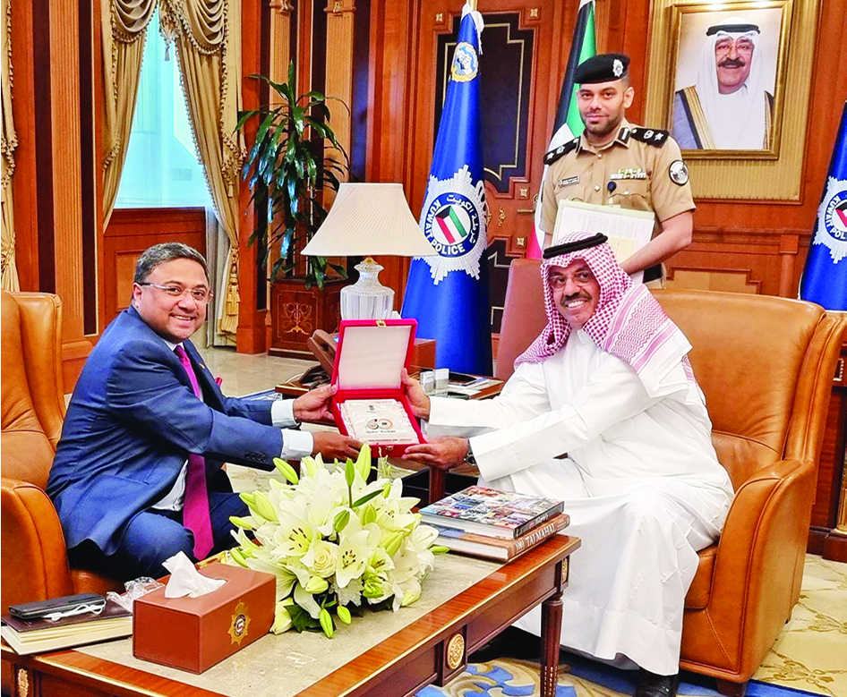 KUWAIT: First Deputy Prime Minister and Minister of Interior Sheikh Ahmad Nawaf Al-Ahmad Al-Sabah and Indian Ambassador Sibi George exchange plaques during the meeting.