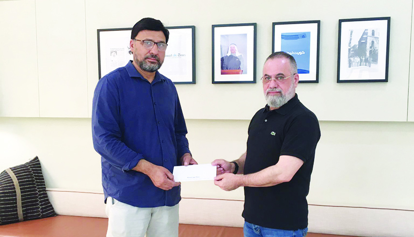 KUWAIT: Aisha Shoaib's father receives the award from Kuwait Times Advertising Manager Taleb Kanjo.