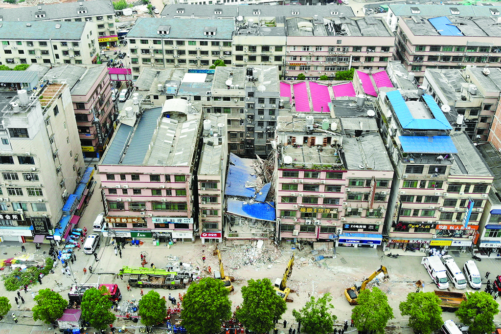 CHANGSHA: This aerial photograph taken on April 29, 2022 shows rescuers working after a six-storey building collapsed in Changsha, in China's central Hunan province. - AFP