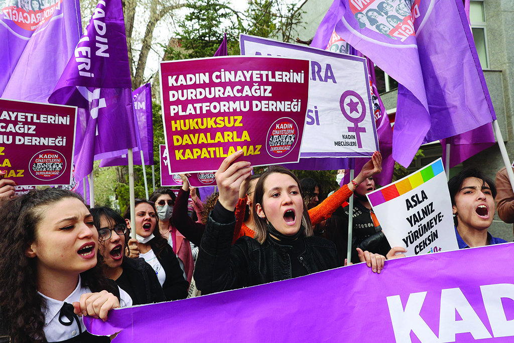 ANKARA: Women hold up banners and shout slogans as they protest against the closure case filed against ‘We Will Stop Femicide Platform Association’ in Ankara on April 16, 2022. - AFP