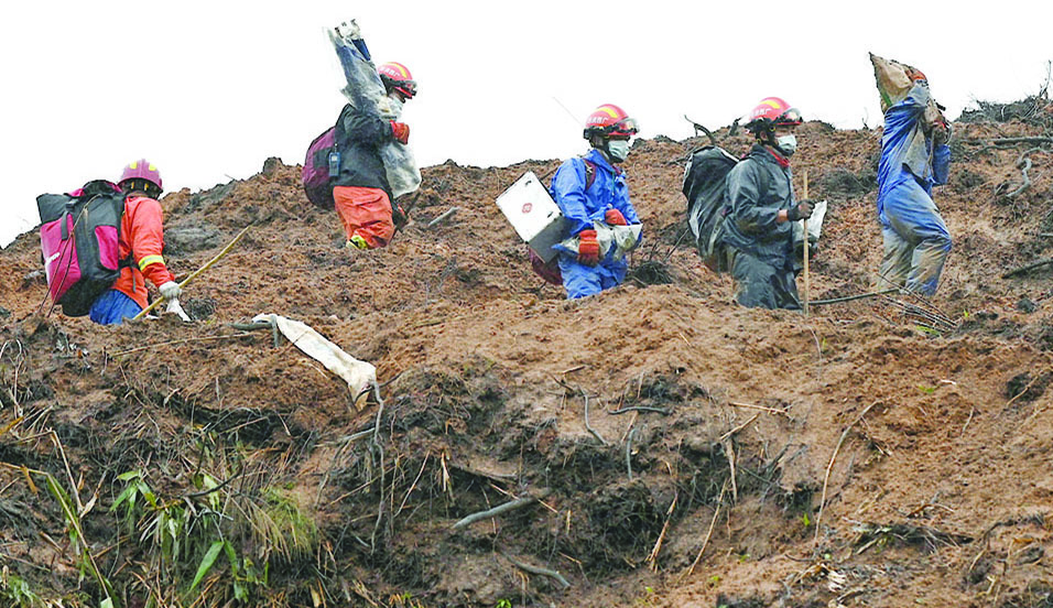 WUZHOU, China: File photo SHOWS rescue workers combing through the site of where China Eastern flight MU5375 crashed on March 21, near Wuzhou in southwestern China’s Guangxi province. – AFP