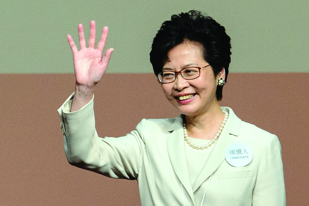 HONG KONG, China: File photo taken on March 26, 2017 shows Hong Kong's Chief Executive Carrie Lam waving after she won the Hong Kong chief executive election. Lam announced on April 4, 2022 that she will not seek another term in office as a pro-Beijing committee prepares to select a new leader next month. – AFPn