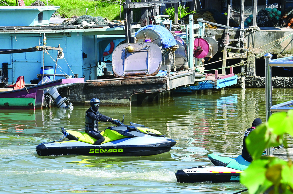 MERSING: Rescue volunteers ride jet skis on the Mersing River during the search to locate three missing divers in Mersing in Johor state on April 8, 2022, after they disappeared off Malaysia's southeast coast. - AFP