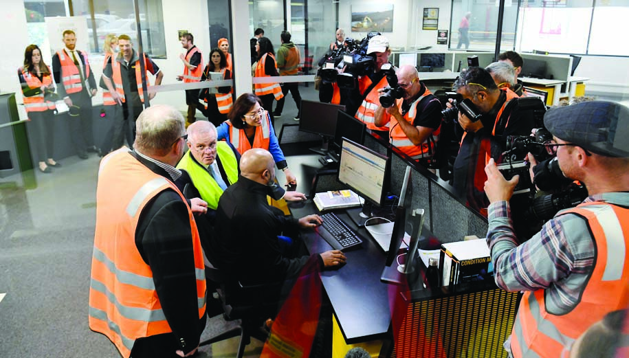 MELBOURNE, Australia: Australia's Prime Minister Scott Morrison (2nd L-yellow vest) tours the William Adams CAT facility in Melbourne. Morrison called for election May 21, seeking to capitalise on a recent budget stocked with sweeteners. - AFP