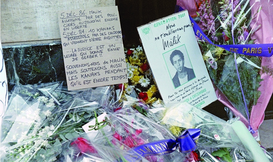 In this file photo taken on December 04, 1987, shows flowers and letters lay in front of the entrance of 20 rue Monsieur le Prince in Paris where Malik Oussekine died, killed by the police a year ago, on the fringe of a demonstration against the reform of the higher education system, best known as the Devaquet law. –AFP photos