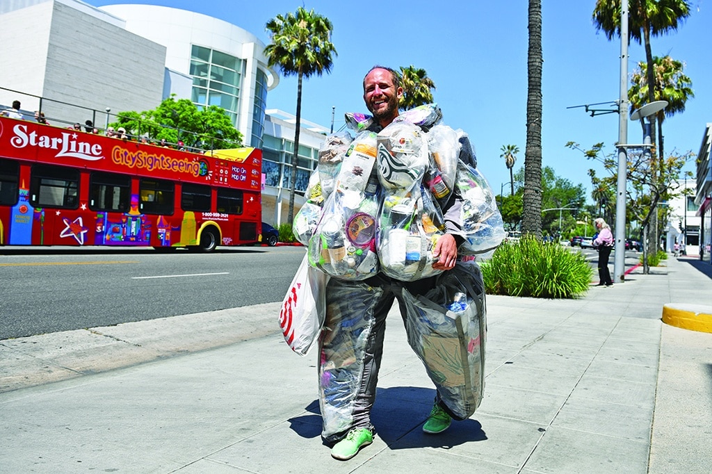 Environmental activist Rob Greenfield walks around Beverly Hills, wearing a suit filled with every piece of trash he has generated living and consuming like a typical American for one month to raise awareness about how much garbage just one person generates.—AFP photos