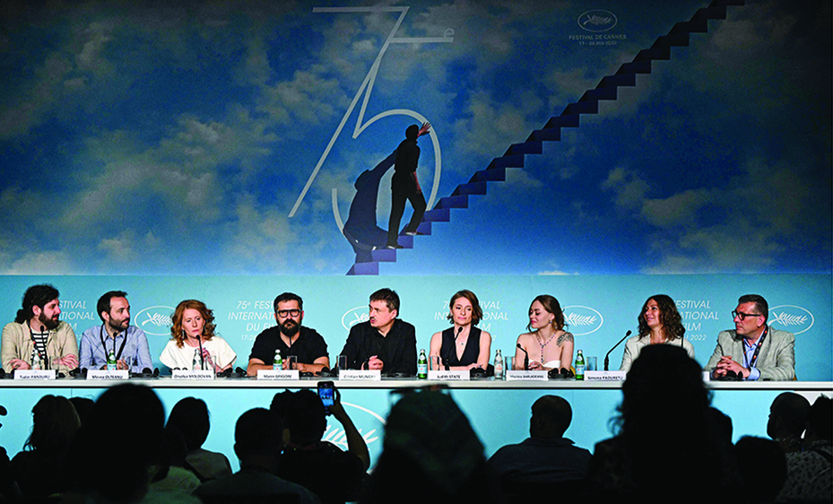 (From left) Romanian cinematographer Tudor Panduru, editor Mircea Olteanu, actress Orsolya Moldovan, Romanian actor Marin Grigore, Romanian film director Cristian Mungiu, Romanian actress Judith State, Romanian actress Macrina Barladeanu, production designer Simona Paduretu and producer Tudor Reu attend a press conference for the film “R.M.N” during the 75th edition of the Cannes Film Festival in Cannes, southern France.—AFP photos