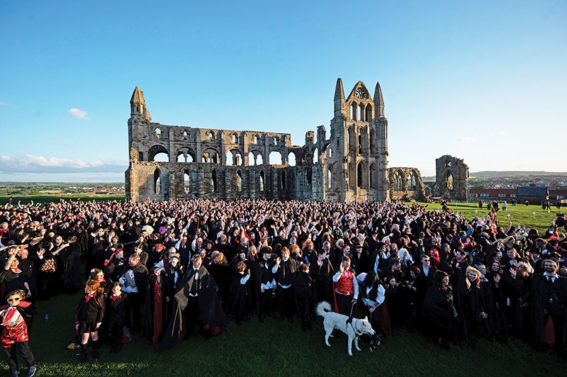 Vampires gather in the grounds of Whitby Abbey during a Guinness world record attempt to gather the largest number of vampires together in one place, in Whitby, north-east England. — AFP photos