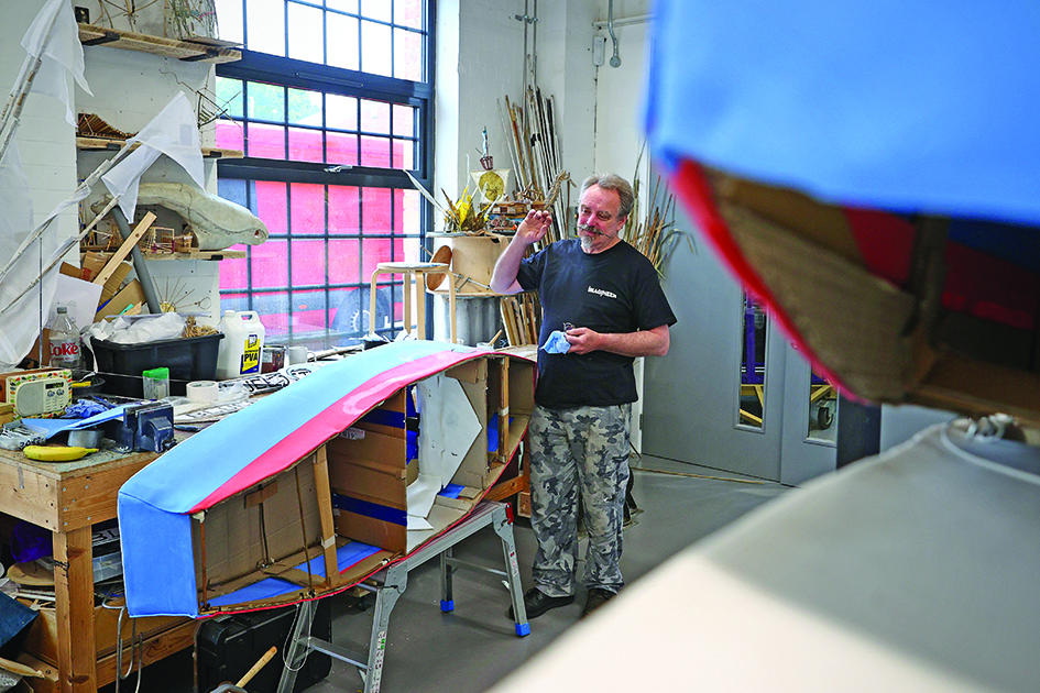 Imagineer maker and puppeteer John Leahy makes a prop of a boat in the company's workshop.