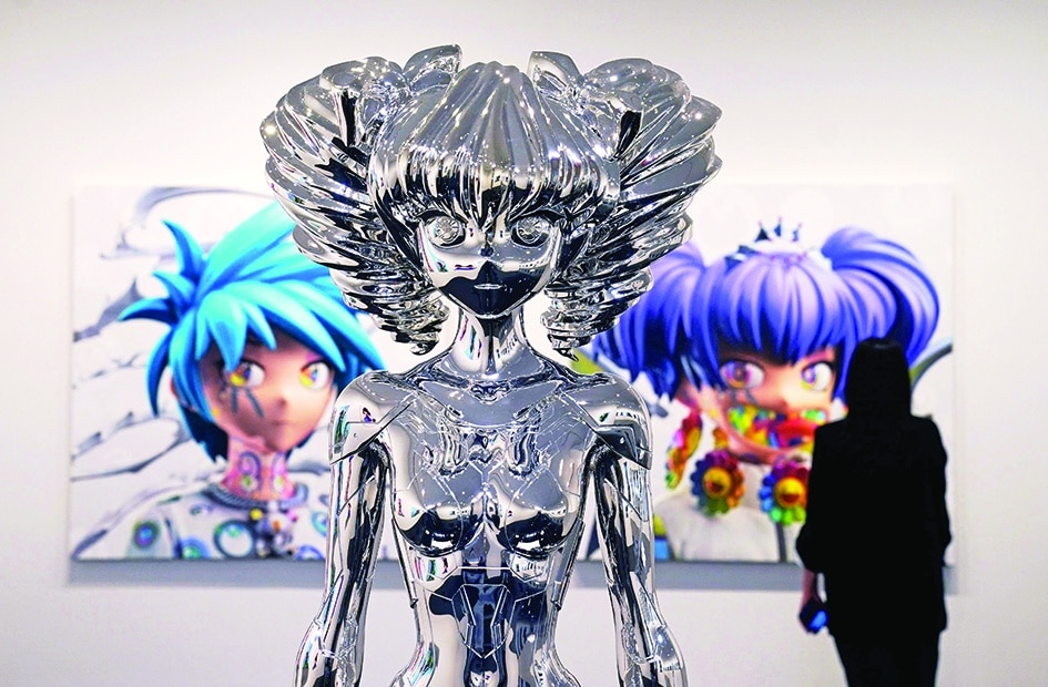 A person stands in front of artist Takashi Murakami’s “Avatar HIROPON Style, 2022”. 
