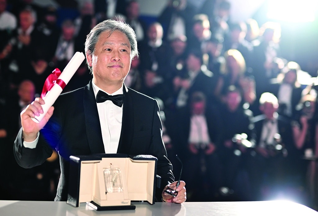 South Korean director Park Chan-Wook poses during a photocall after he won the Best Director prize for the film 