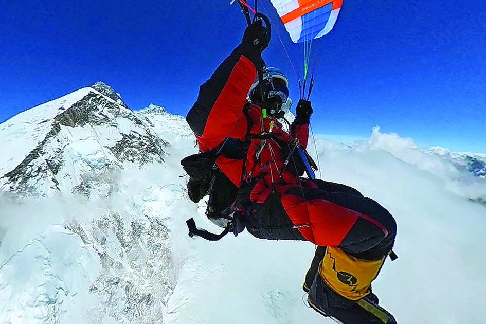 This handout photograph shows South African paraglider Pierre Carter gliding off from the South Col Mt Everest as he flews back to Gorak Shep in Solukhumbu Everest region.—AFP photos