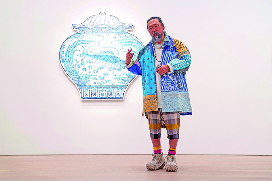 Artist Takashi Murakami stands in front of 