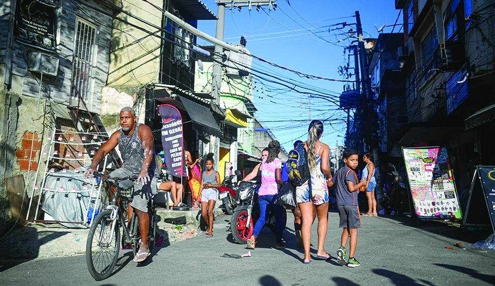 RIO DE JANEIRO, Brazil: People walk on the streets of Jacarezinho favela in Rio de Janeiro, Brazil. One year after 28 people were killed in the bloodiest police raid in Rio de Janeiro history, the tension is still palpable in the Jacarezinho slum, where authorities have deployed a massive law enforcement operation. - AFP
