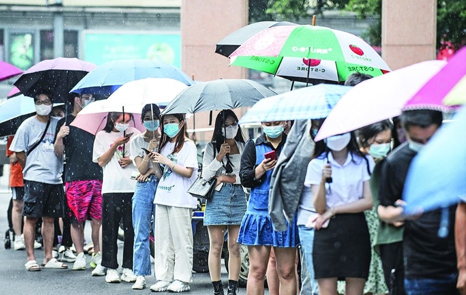 GUANGZHOU, China: Residents queue to undergo nucleic acid tests for the COVID-19 coronavirus in Guangzhou, in China's southern Guangdong province on May 7, 2022. – AFP