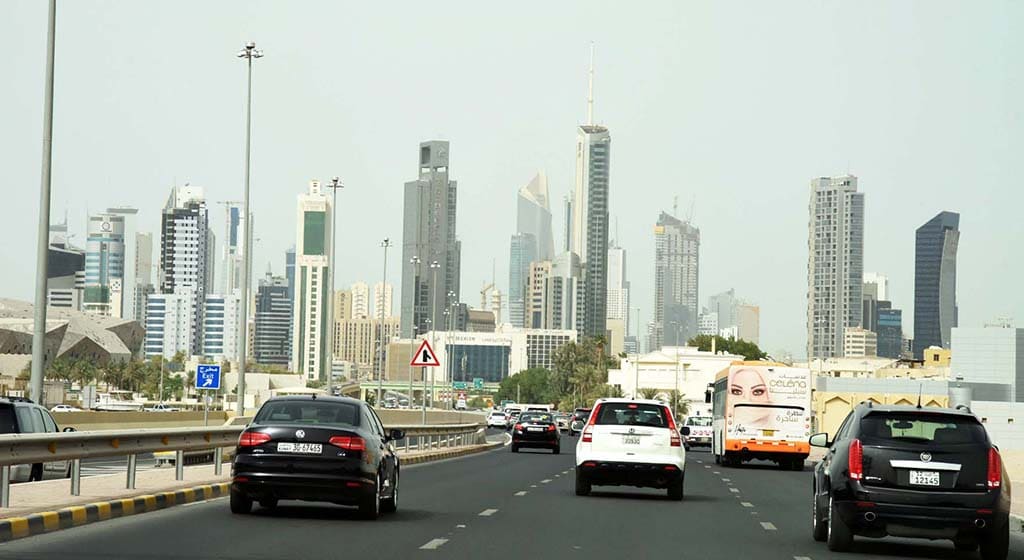 KUWAIT: Vehicles drive on a main road as Kuwait City skyscrapers are seen in the background. - Photo by Fouad Al-Shaikh