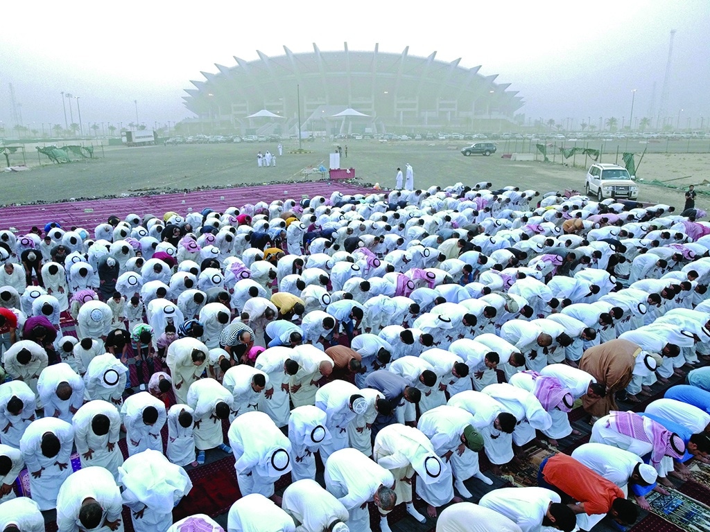 KUWAIT: Muslim devotees pray on the first day of Eid Al-Fitr, which marks the end of the holy fasting month of Ramadan, near the Jaber Al-Ahmad International Stadium in Kuwait on May 2, 2022. - Photo by Yasser Al-Zayyat