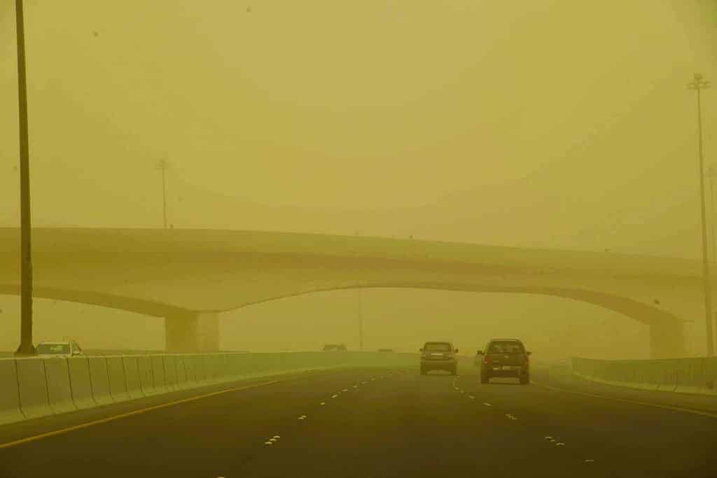 KUWAIT: Vehicles drive through heavy dust on a highway in Kuwait on May 7, 2022. Kuwait is expected to be hit by another dust storm this weekend according to weather forecasts. - Photo by Fouad Al-Shaikh