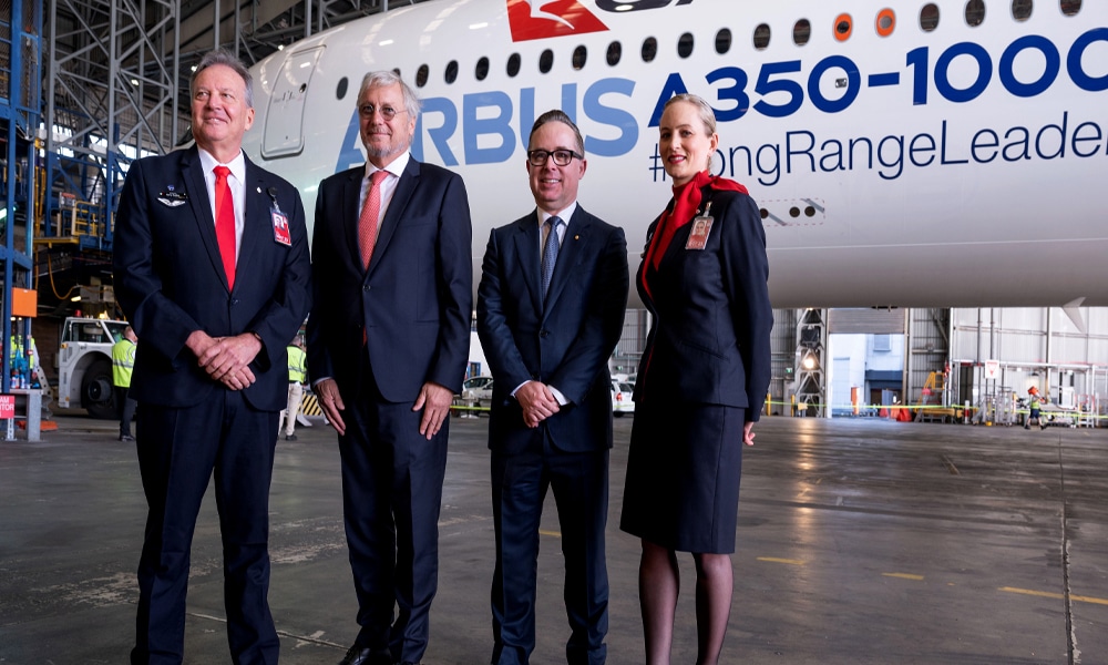 SYDNEY: Chief Executive Officer of Qantas Airways Alan Joyce (second right) along with other officials attend the ceremony of an Airbus A350-1000 aircraft fleet announcement at Sydney international airport on May 2, 2022.— AFP