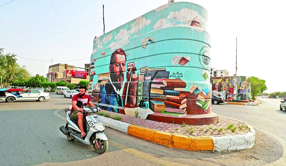 A picture shows a mural of German sociologist Max Weber, drawn by Iraqi painter Wijdan Al-Majed, on a concrete structure in the capital Baghdad. Iraqi artist Wijdan Al-Majed is transforming Baghdad’s concrete jungle into a color-filled city with murals depicting well-known figures from the war-scarred country and abroad. – AFP photos
