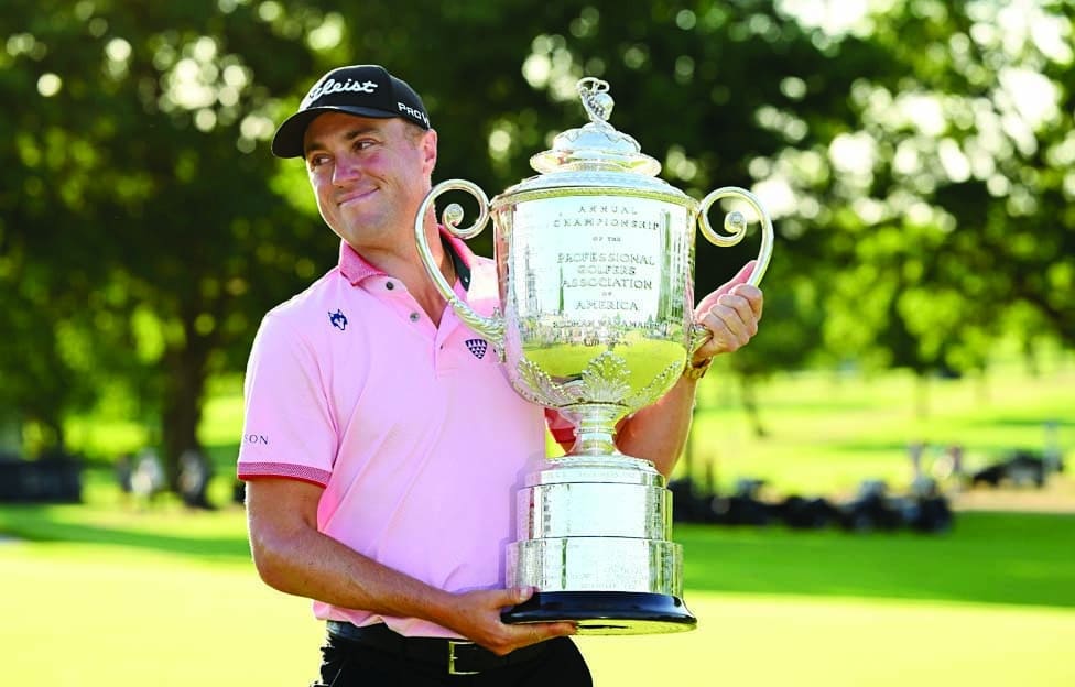 TULSA: Justin Thomas of the USA celebrates with the Wanamaker Trophy after the final round of the PGA Championship at Southern Hills Country Club on May 22, 2022. - AFP