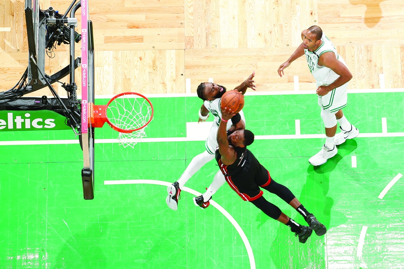 BOSTON: Bam Adebayo #13 of the Miami Heat dunks the ball against the Boston Celtics during Game 3 of the 2022 NBA Playoffs Eastern Conference Finals on May 21, 2022. - AFPn