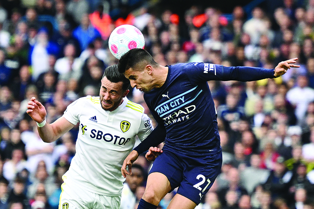 LEEDS: Leeds United's English midfielder Jack Harrison vies with Manchester City's Portuguese defender Joao Cancelo during their English Premier League match at Elland Road on April 30, 2022. – AFP