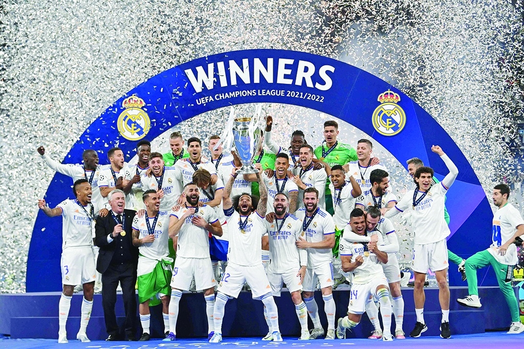 SAINT-DENIS, France: Real Madrid's Brazilian defender Marcelo lifts the Champions League trophy after Madrid's victory in the UEFA Champions League final against Liverpool at the Stade de France north of Paris on May 28, 2022. - AFP