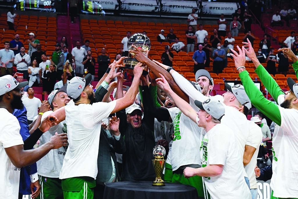 MIAMI, FL - MAY 29: The Boston Celtics celebrate with the Bob Cousy Eastern Conference Championship Trophy after Game 7 of the 2022 NBA Playoffs Eastern Conference Finals on May 29, 2022 at the FTX Arena in Miami, Florida. NOTE TO USER: User expressly acknowledges and agrees that, by downloading and or using this photograph, User is consenting to the terms and conditions of the Getty Images License Agreement. Mandatory Copyright Notice: Copyright 2022 NBAE   Brian Babineau/NBAE via Getty Images/AFP (Photo by Brian Babineau / NBAE / Getty Images / Getty Images via AFP)