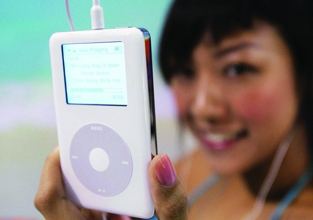 HONG KONG: In this file photo taken on July 21, 2004, a model shows the latest model of Apple iPod during a press conference. - AFP