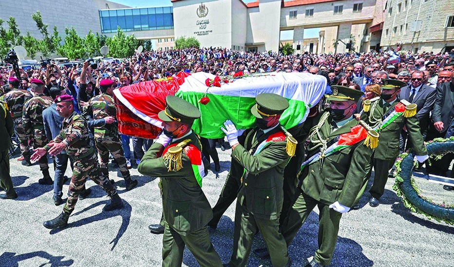 RAMALLAH: Palestinian honor guard carry the coffin of veteran Al-Jazeera journalist Shireen Abu Akleh following a state funeral at the presidential headquarters on May 12, 2022. – AFP
