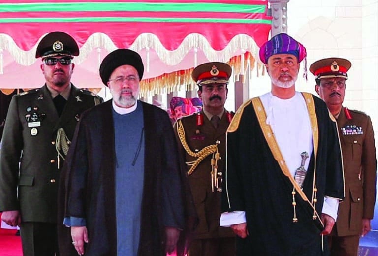 TEHRAN: Sultan of Oman Haitham bin Tariq welcomes Iran's President Ebrahim Raisi upon arrival to the Omani capital on May 23, 2022. - AFP