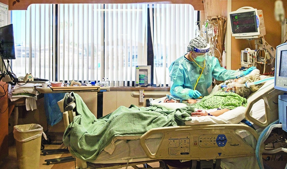 APPLE VALLEY, California: In this file photo taken on Jan 11, 2021, a nurse tends to a COVID-19 patient in the ICU at Providence St Mary Medical Center. – AFP