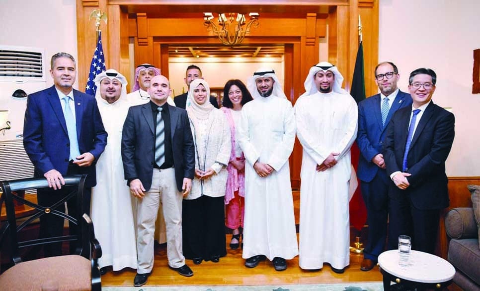 KUWAIT: Officials pose for a group photo during the US Embassy reception on the occasion of removing Kuwait from the US intellectual property watchlist. - Photo by Yasser Al-Zayyat