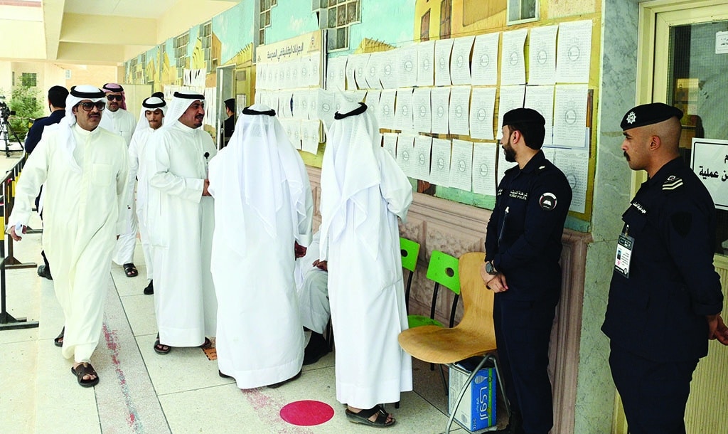 KUWAIT: Citizens are seen at a polling station during the Municipal Council elections on Saturday. - Photos by Yasser Al-Zayyat