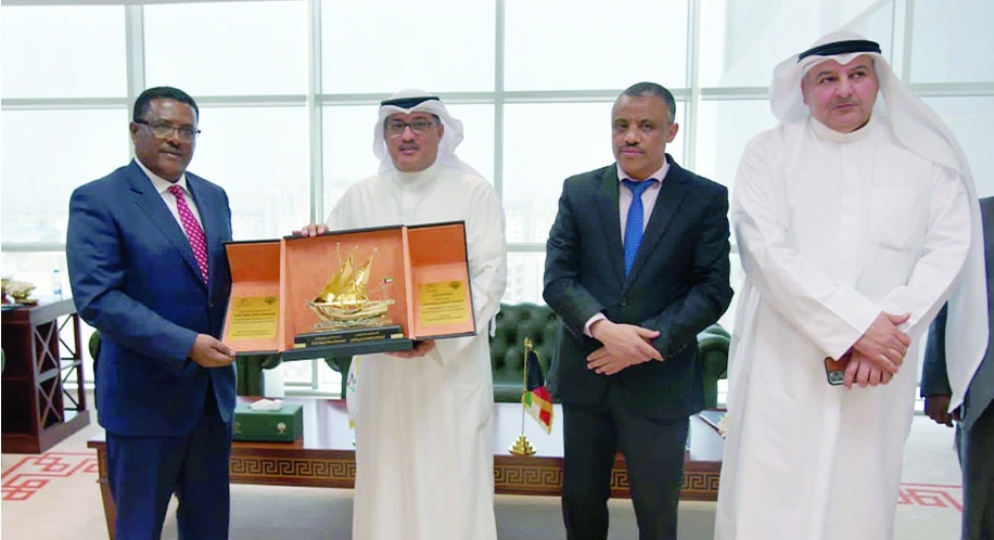KUWAIT: Minister Justice and Minister for Integrity Promotion Affairs Jamal Al-Jalawi presents a memento and Nigussu Tilahun Gebreamanuel - Commissioner for the Jobs Creation Commission in Ethiopia. - KUNA