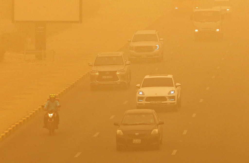 KUWAIT: Cars drive amid a heavy sandstorm in Kuwait City on May 16, 2022. - Photo by Yasser Al-Zayyat