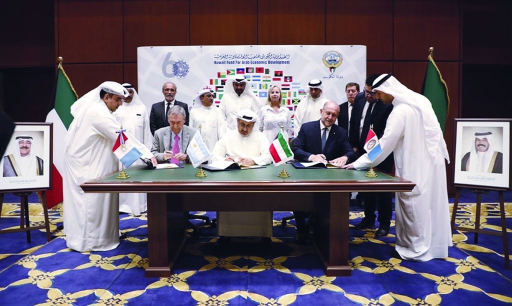 KUWAIT: Officials sign the agreement. - KUNA