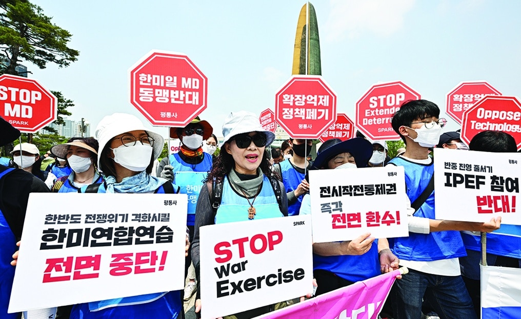 SEOUL: Activists protest against the visit of US President Joe Biden near the presidential office, where he will hold meetings with South Korean President Yoon Suk-yeol in Seoul. – AFP