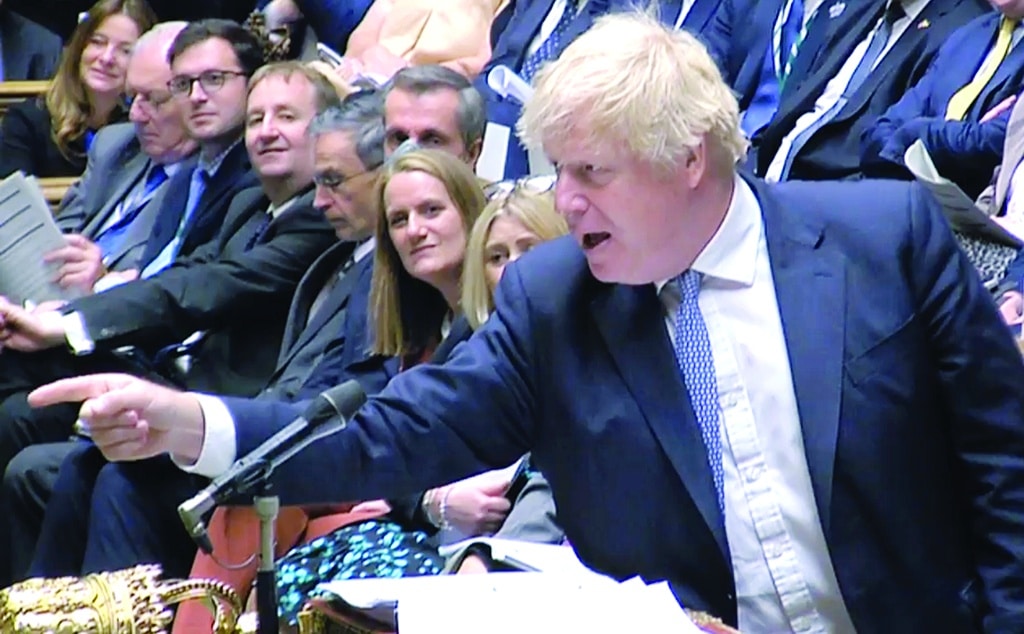 LONDON: A video grab from footage broadcast by the UK Parliament's Parliamentary Recording Unit (PRU) shows Britain's Prime Minister Boris Johnson during the weekly session of Prime Minister's Questions (PMQs) at the House of Commons, in London, on May 25, 2022.- AFP