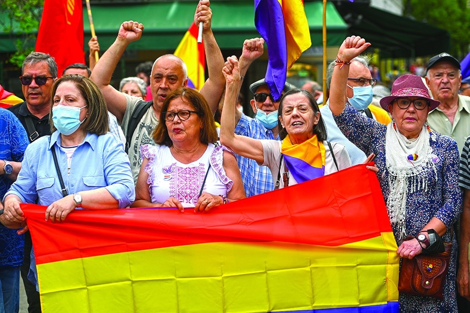 MADRID: Protesters hold a Republican flag during an anti-monarchy demonstration in Madrid on May 22, 2022, coinciding with the return to Spain of former king Juan Carlos I. – AFP