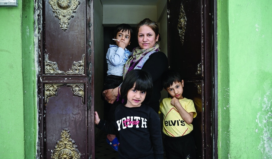 SANLIURFA: Fatima Ibrahim, who came from Kobane, poses with her children, in Sanliurfa on May 17, 2022. Turkey has fervently opposed Syrian President Bashar al-Assad, backing rebels calling for his removal and opening its doors to refugees. - AFP