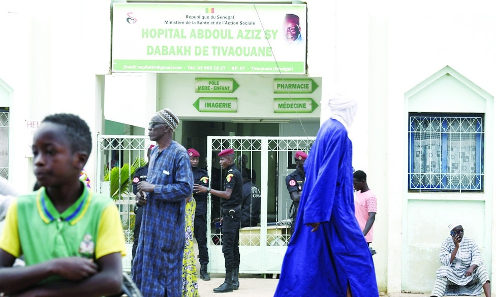 TIVAOUANE, Senegal: Visitors stand in front of the Mame Abdoul Aziz Sy Dabakh Hospital, where eleven babies died following an electrical fault, in Tivaouane, on May 26, 2022. - AFP