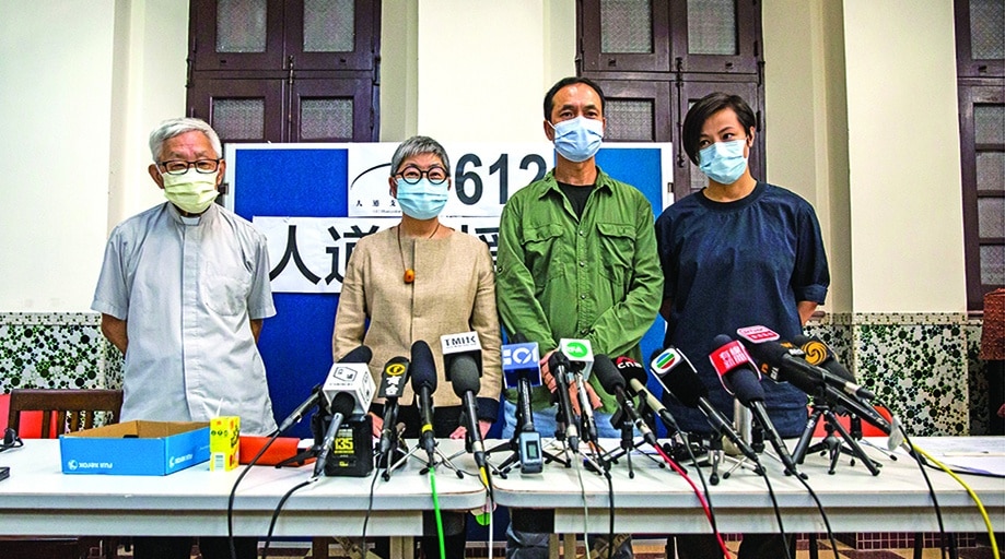 HONG KONG: File photo taken on August 18, 2021 shows (L-R) Cardinal Joseph Zen, barrister Margaret Ng, professor Hui Po-keung and singer Denise Ho attending a press conference at Salesian Missionary House in Hong Kong, to announce the closure of the 612 Humanitarian Relief Fund, established to support democracy protesters. – AFP