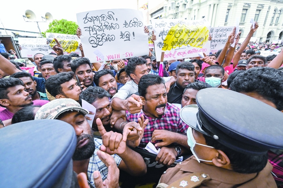 COLOMBO, Sri Lanka: Protestors take part in an anti-government demonstration outside the Sri Lanka police headquarters in Colombo on May 16, 2022, demanding the arrest of government supporters who allegedly assaulted peaceful demonstrators who had been demanding the resignation of President Gotabaya Rajapaksa amid ongoing economic crisis. – AFP