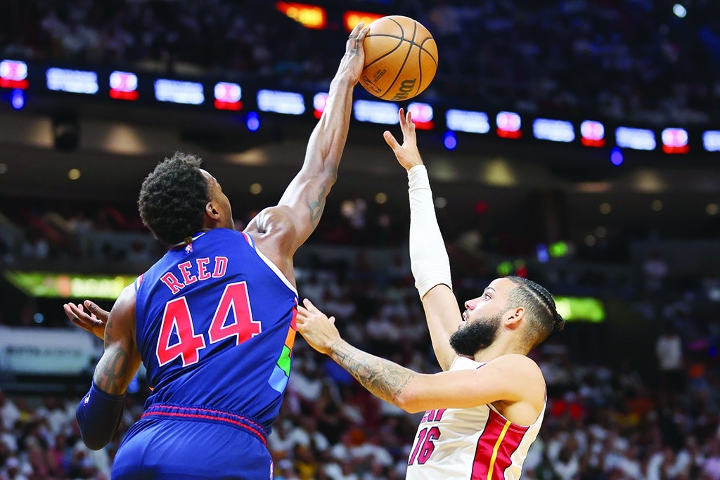 MIAMI: Paul Reed #44 of the Philadelphia 76ers blocks a shot by Caleb Martin #16 of the Miami Heat during the second half in Game Five of the Eastern Conference Semifinals at FTX Arena on May 10, 2022.- AFP